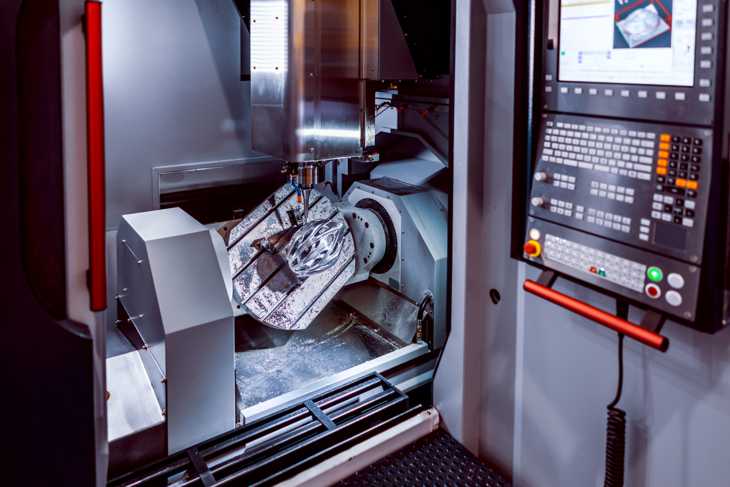 Metalworking CNC milling machine. Cutting metal modern processing technology. Small depth of field. Warning - authentic shooting in challenging conditions. A little bit grain and maybe blurred.